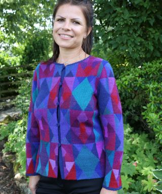 Women's Peruvian alpaca cardigan in a mosaic pattern of blue, purple and red with buttons