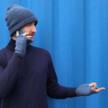 Warm man on the phone wearing Alpaca products